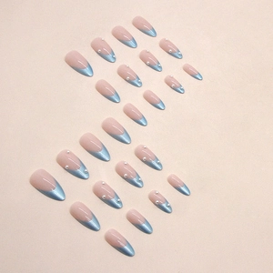 Blue aurora French almond press-on nails with pearl accents and nude base finish