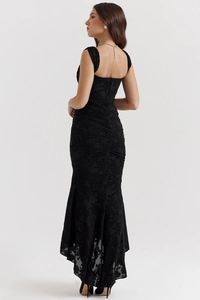 Detailed view of black lace embroidery and fishbone structure on back of evening gown