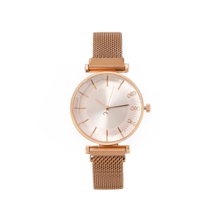 Detail of rose gold mesh watch band with magnetic buckle and rhinestone dial markers