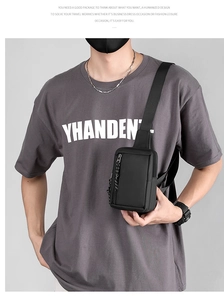 Detailed view of black waterproof crossbody chest bag for men with adjustable strap