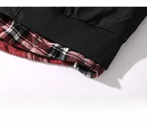 Detail shot of the casual jacket hem showing black ribbed cuff and plaid lining