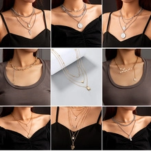 Multi-layered gold and silver necklace set with lock, key and love letter pendants