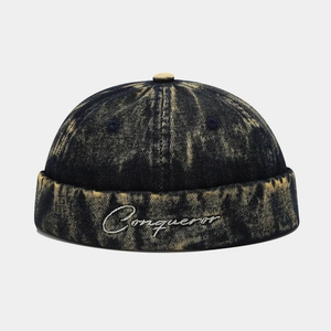 Vintage navy denim Miki hat with yellow wash and Conqueror embroidery on front