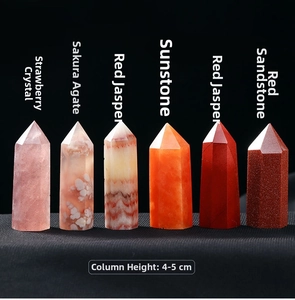 Detail of 4-5cm hexagonal crystal points in strawberry quartz and various gems