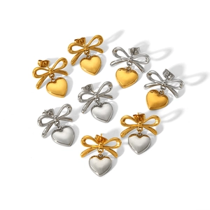 Polished titanium steel bow and heart earrings in gold and silver finish