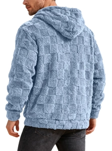 Detail of light blue men's hoodie with fleece chessboard texture and hooded design