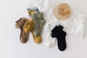 Detailed close-up of 5-pack girl's cotton socks with vintage lace trim and cable knit texture