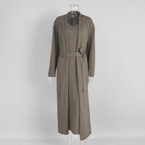 Close-up of taupe knitted long cardigan and V-neck dress set with matching waist belt