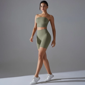 Close-up of olive green two-piece seamless yoga set with sports top and high-waist shorts