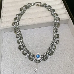 Ethnic style woven pearl necklace with blue gemstone and waterdrop pendant for women
