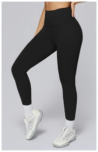 Detail of high waisted black yoga leggings with tummy control and compression fit