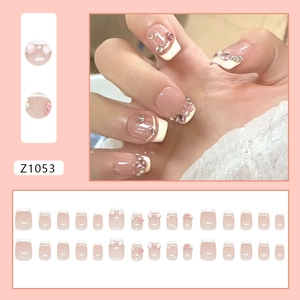 Pink gradient French press-on nails with 3D bows, pearls and rhinestone decorations