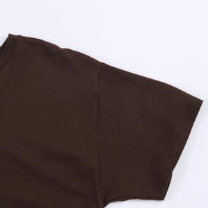 Detail view of round neckline and shoulder stitching on a brown short-sleeved t-shirt