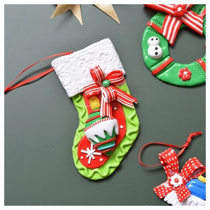 Detailed macro view of festive red and green polymer clay Christmas ornaments