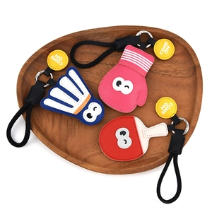 Creative PU leather sports keychains featuring badminton, boxing glove, and paddle designs