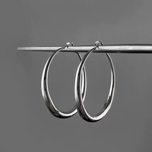 Minimalist silver hoop earrings for women with high-shine polished metallic finish