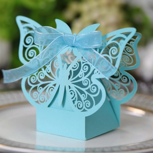 Close-up of sky blue laser-cut candy box featuring hollow butterfly design and ribbon bow