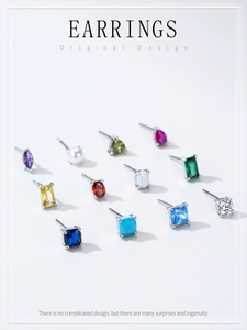 Macro shot of twelve assorted S925 sterling silver birthstone studs in various colors