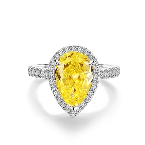 Pear cut yellow gemstone ring with micropave zircon halo in sterling silver