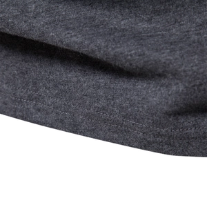 Men's long sleeve crewneck t-shirt detail showing dark grey heathered fabric and hem