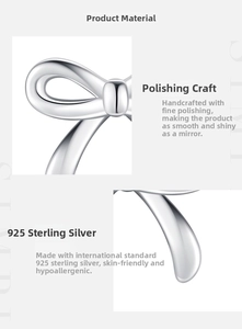 Macro detail of s925 sterling silver bow earrings with hand-polished mirror finish