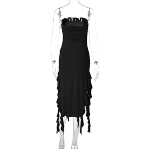 Detail of black bodycon dress with ruching and irregular ruffled hem in gothic style