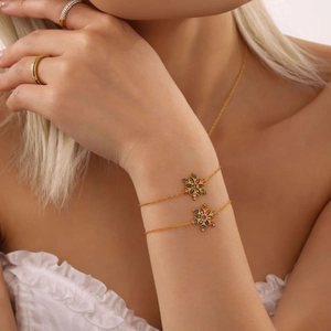 Elegant 18K gold plated snowflake bracelet with colorful zircon stones on woman's wrist