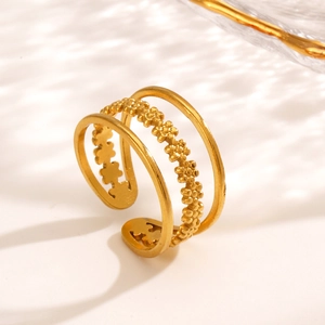 Three-layer gold stainless steel open ring with floral bead details on white background