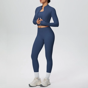 Three-piece navy blue yoga set featuring a zip jacket, sports bra and high-waisted leggings