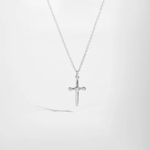 Detailed macro view of S925 sterling silver arrow cross pendant with sparkling zircons