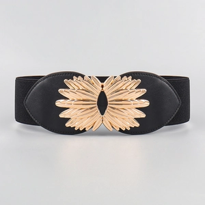 Close-up of golden sunflower alloy buckle on a black elastic waist belt for women