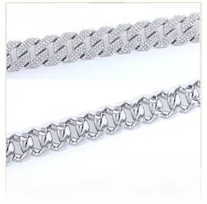 Macro detail of silver Cuban link necklace showing front iced-out pavé and back polished finish