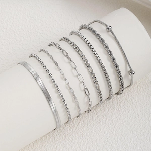 8-piece silver chain bracelet set featuring snake, rope, and paperclip minimalist designs