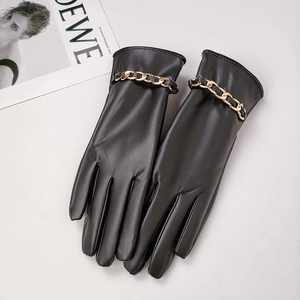 Women's black PU leather gloves featuring a stylish gold chain link and warm lining