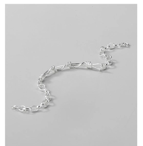 Macro shot of S925 sterling silver twisted cable bracelet showing fine metal texture