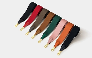 Colorful wide fabric bag straps with leather ends and golden metal clips in eight colors