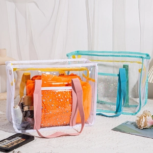 Detailed view of white and blue mesh beach bags with holographic star pocket designs