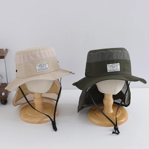 Close-up of mesh vent and neck flap on outdoor sun hats for boys in beige and green