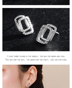 Macro shot of 925 sterling silver double-layer geometric earrings with zircon inlay