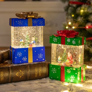 Christmas lantern music box with glowing crystal ball and festive Santa figures