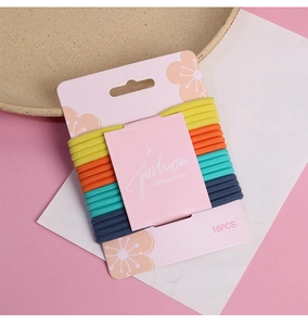 Close-up of 16 high-elastic hair ties in multi-colors arranged on a display card