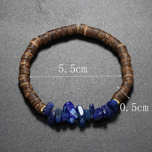 Detail view of handmade beaded bracelet with brown wood beads and blue stones showing 5.5cm size