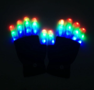 Close-up of black LED glowing gloves with colorful light-up fingertips for party dance