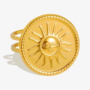 Macro shot of 18k gold plated stainless steel sun face relief ring with intricate details