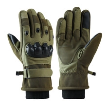 Detail of olive green tactical gloves with hard knuckle shells and Velcro wrist straps