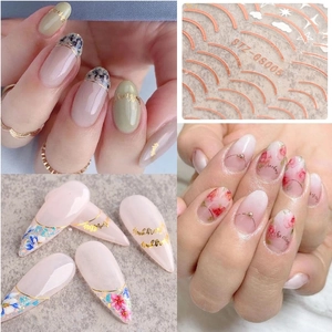 French style gold nail stickers with stars and metallic line designs for manicures