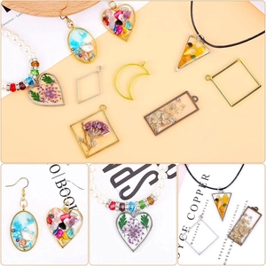 Detailed close-up of hollow metal geometric pendants filled with dried flowers and resin