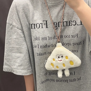 Lanyard view of a plush cheese coin purse with cute embroidery on a gray t-shirt
