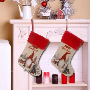 Classic Christmas stockings with gnome and reindeer patterns hanging on a white fireplace