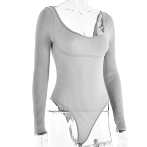 Detail view of grey long sleeve bodysuit in ribbed cotton fabric with a deep U-neckline